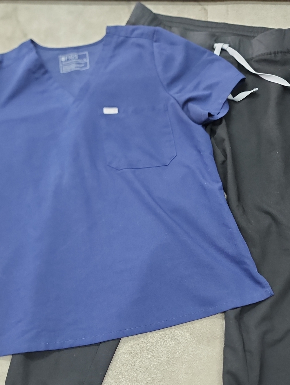 Figs Women’s Royal Blue V-Neck Scrub Top with Black Pants